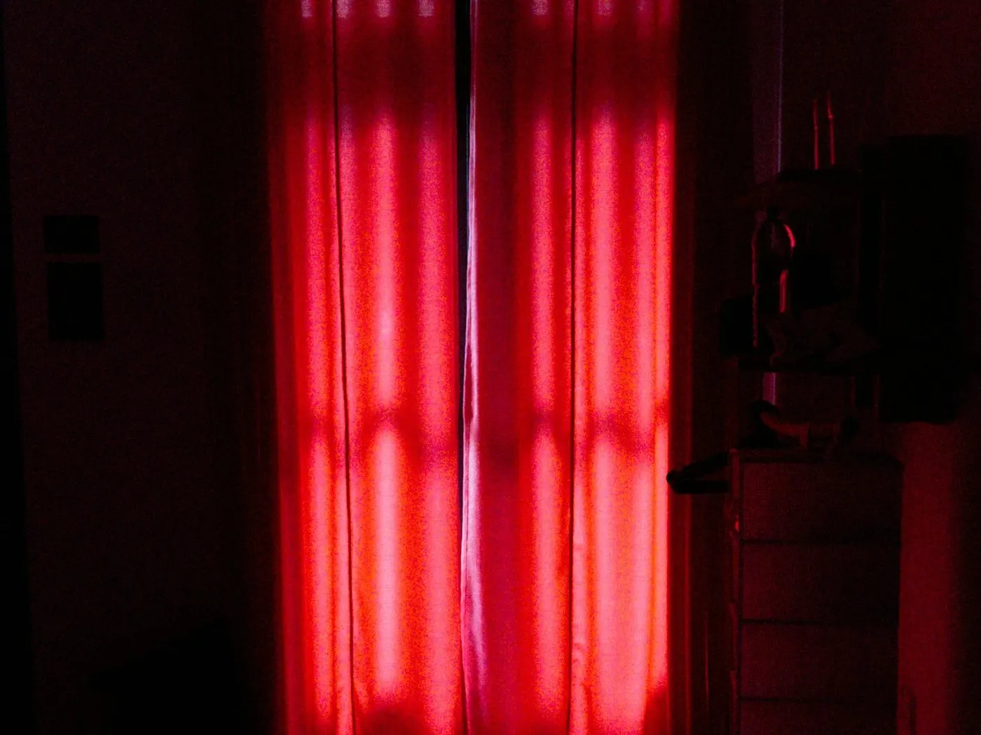 Rows of red therapy light panels glowing in a treatment room