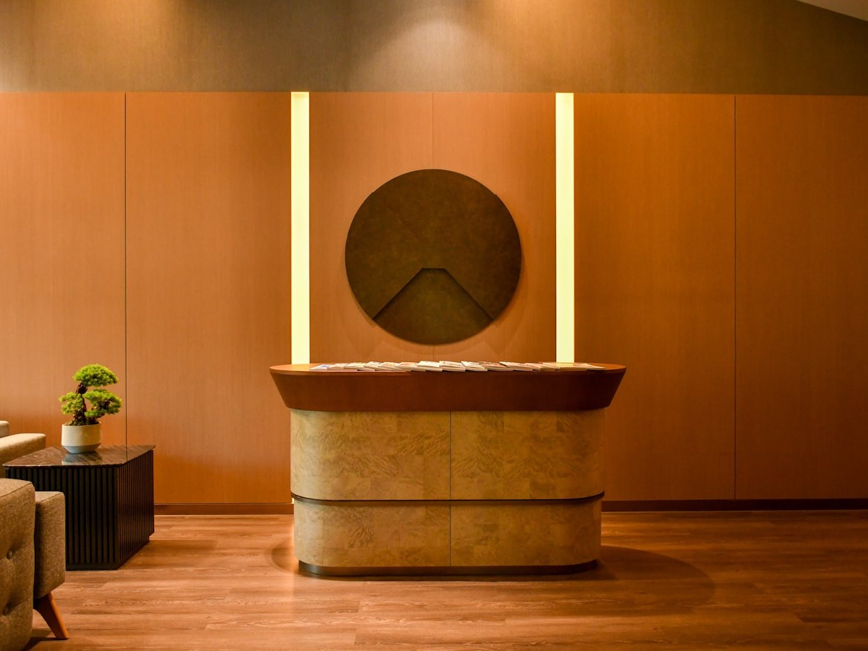 A calm, warmly lit reception desk