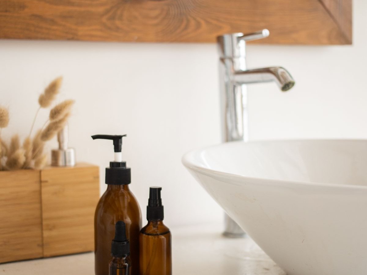A clean vanity and washbasin with fresh towels