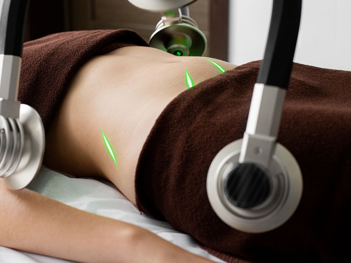 A body contouring device in position over a patient's midsection