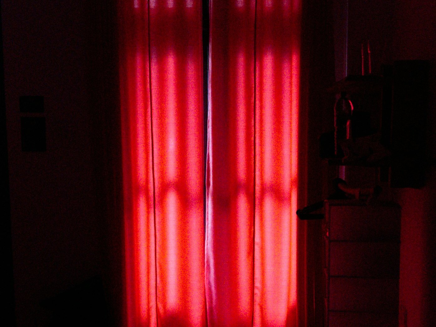 Rows of red therapy light panels glowing in a treatment room